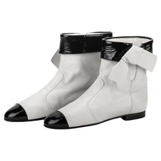 Chanel new white leather and black patent ankle boots. European size 39 , run half a size smaller. Come with original box. Chanel White Boots, White Ankle Boots, Chanel White, Chanel Vintage, White Boots, White Leather, Wedge Boot, Clothing And Shoes, Original Box