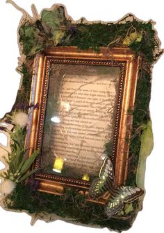 an old frame is decorated with plants and leaves, including a butterfly on the page