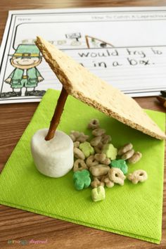 a paper plate with cereal and an umbrella on it next to a green napkin that says i would fly up in a sky