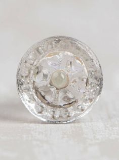 a clear glass object sitting on top of a table