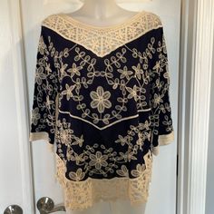 Solitaire Crocheted & Embroidered Top With Lace Detail Blouse Top Floral Print Blue And Cream Color Size Medium New With Tags2nd Pic Shows Color The Best P2p Is Approx 20” Shoulder To Hem Is 24 On The Sides But Slants Longer In The Center Embroidered Lace V-neck Top, V-neck Lace Blouse With Floral Embroidery, Lace V-neck Blouse With Floral Embroidery, Elegant Blue Blouse With Chikankari Embroidery, Cream Summer Tops With Chikankari Embroidery, Summer Cream Tops With Chikankari Embroidery, Elegant Blue Top With Intricate Embroidery, Elegant Blue Tops With Intricate Embroidery, Blue Lace Blouse With Lace Trim