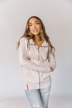 From morning errands to laid-back evenings, the FullZip Dove is your go-to choice for comfort and style. Whether you're layering it over your favorite tee or wearing it as a standalone piece, its versatility and minimalist design create a polished look that's unmistakably you. Embrace the harmony of simplicity and luxury as you step into the embrace of this exquisite full-zip hoodie. Dove: Triple Stretch - Solid Cream Body Features: Thumbholes Side Pockets Cotton/SpandexModel is wearing a size Small. Ampersand Logo, Swim Jewelry, Rachel Clark, Cream Body, The Embrace, Outfit Combinations, Beauty Collection, Full Zip Hoodie, Polished Look