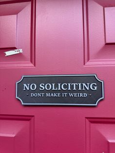 a red door with a sign that says no soliciting don't make it weird