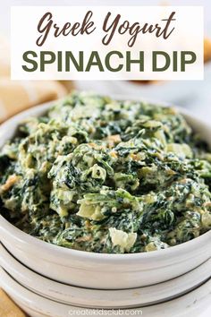 a white bowl filled with spinach dip