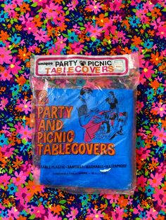 the party and picnic table covers are blue with colorful sprinkles on it