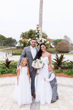 a bride and groom with their two children