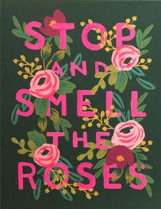 the words stop and smell the roses are painted on a green background with pink flowers