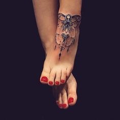 a woman's foot with a tattoo on it