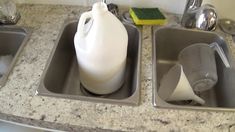 a pitcher and two pans sitting on top of a kitchen counter next to each other