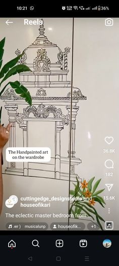 someone is drawing on the wall with their cell phone while holding a plant in front of them