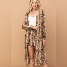 The Snake Print Kimono Open Front Longline Cardigan Brings A Touch Of Exotic Flair To Your Wardrobe. Its Open-Front Design And Longline Cut Create A Graceful, Elongated Silhouette, While The Striking Snake Print Adds A Bold, Fashionable Edge. Made From A Soft, Lightweight Fabric, This Cardigan Offers Both Comfort And Style. Perfect For Layering Over Jeans Or Dresses, It Effortlessly Elevates Any Outfit. Embrace A Unique, Modern Look With This Eye-Catching And Versatile Piece. Features: Basic Sty Pink Plaid Shirt, Thanksgiving Fashion, Normal Body, Longline Cardigan, Baywatch, Print Kimonos, Plus Size Maxi, Short Dresses Casual, The Snake