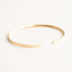 Our Minimal Cuff Bracelet is simple & modern, yet will elevate any look. You can easily stack it with your favorite bracelets (we love it with Braided Cuff Bracelet, Thick Chain Bracelet, & Dainty Rope Bracelet), or just wear it by itself. DETAILS 14k gold filled -or- sterling silver cuff (flat outside, rounded inside) 2.5mm width Adjustable - one size fits all Bracelet Stacks, Horizontal Lines, Bracelet Dainty, Simple Bracelets, Gold Bracelet Cuff, Gold Cuffs, Sterling Silver Cuff, Ring Size Guide, Favorite Rings