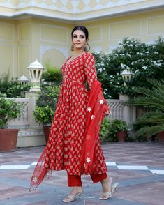 This is a one of a kind 3-piece set. It comes with cotton hand block print anarkali kurta with 32 kali and gota detailing on sleeves & neck has 3/4th flared sleeves & ankle length.The set also comes with handblock print pants with elasticated waistband and kota doria dupatta with gota patti detailing. Color-Red Kurta Fabric-Voil Cotton Bottom Fabric-Voil Cotton Dupatta Fabric-Kota Doria Work-Block Print & Gota Patti Detailing Neck-V Neck Sleeves-3/4th Flared Sleeves Washing Care-Dry Clean Only Cotton Palazzo Set With Gota Work And Long Sleeves, Cotton Long Sleeve Palazzo Set With Gota Work, Long Sleeve Cotton Palazzo Set With Gota Work, Anarkali Palazzo Set With Block Print And Long Sleeve, Transitional Cotton Palazzo Set With Long Sleeves, Cotton Anarkali Set With Gota Work For Festive Occasion, Cotton Salwar Kameez With Gota Work, Festive Straight Kurta Salwar Kameez With Block Print, Designer Cotton Anarkali Set For Festivals