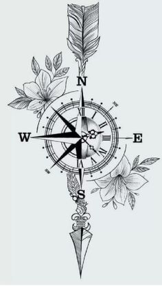 a compass with flowers on it and the words compastato flowerattoo