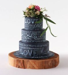 a three tiered cake with flowers on top