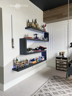 a bedroom with shelves and toys on the wall