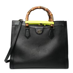 This is an authentic GUCCI Calfskin Medium Diana Tote Bag in Black and Yellow Fluo. This chic shoulder bag is crafted of black calfskin leather. The bag features a looping bamboo top handles, an optional shoulder strap, and aged gold hardware. The top opens to a beige microfiber interior with a patch pocket. Gucci Shoulder Bag With Bamboo Handle For Daily Use, Chic Gucci Shoulder Bag With Bamboo Handle, Classic Gucci Bag With Bamboo Handle, Gucci Bamboo Handle Tote Shoulder Bag, Gucci Top Handle Shoulder Bag With Bamboo Handle, Gucci Satchel With Bamboo Handle, Evening Leather Shoulder Bag With Bamboo Handle, Leather Shoulder Bag With Bamboo Handle For Evening, Gucci Rectangular Bag With Bamboo Handle