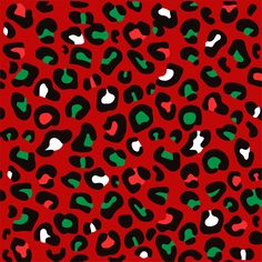 a red and black animal print pattern with green spots on the bottom half of it