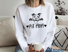 We have both bella canvas and gildan softstyle shirts in our stock. We usually ship what we have in stock at that time. Please ask for YOUTH , TODDLER and BABY Sizes  Pit Mom Sweatshirt, Dog Mom T-Shirt, Pitbull Mom Sweatshirt, Pet Lover Tee, Pit Bull Mom Gift, Dog Lover Gift, Dog Owner Sweatshirt 🔆30% OFF SALE FOR OUR BEST SELLING SHIRTS 🔆 📏Note: Our shirts are Unisex style. This is in between women's and men's sizes. Comfy laid-back style. If you are wanting the shirt to be more fitted, you Pit Mom, Pitbull Mom, Mama Sweatshirt, Mom Sweatshirt, Solid Color Shirt, Unique Presents, Dog Owner, Pet Lover, Laid Back Style