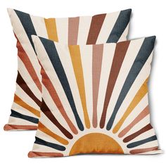 two pillows with sun design on them