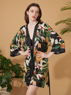 Crafted with meticulous attention to detail, our kimono robe embodies the essence of Eastern luxury, offering you a truly indulgent experience every time you slip it on. Its versatile design effortlessly transitions from leisurely mornings to elegant evenings, ensuring you stay elegant and refined throughout the day. • Silky Comfort: Made of high-quality polyester charmeuse, our robes are soft, lightweight and cooling for summer. They have a smooth and breathable texture that feels just like nat Black Long Sleeve Summer Sleepwear, Elegant Black Sleepwear For Home, Black Sleepwear For Vacation In Spring, Black Sleepwear For Spring Vacation, Black Summer Loungewear Robe, Black Spring Sleepwear For Home, Black Summer Beach Robe, Elegant Black Summer Robe, Elegant Black Kimono For Loungewear