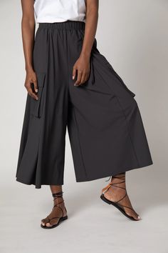 These cargo skirt pants are a fresh take on the current military cargo pants. Pair this gorgeous draped styling piece with a basic white tee for an easy weekend look, or the All Day Washable Silk blouse for a fashion-forward evening look Chic Stretch Cargo Pants For Summer, Chic Stretch Summer Cargo Pants, Chic Summer Stretch Cargo Pants, Chic Solid Color Summer Cargo Pants, Utility Cargo Skirt For Summer Workwear, Summer Versatile Cargo Pants With Loosely Fitted Hips, Versatile Summer Cargo Pants With Loosely Fitted Hips, Summer Versatile Cargo Pants, Chic Summer Parachute Pants With Cargo Pockets