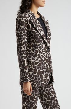 A fierce print powers up an oversized jacket cut with strong shoulders from a cotton-forward blend. One-button closure Peaked lapels Three-button cuffs Chest welt pocket; front welt pockets Back vent Lined 54% cotton, 42% polyester, 4% other fibers Dry clean Made in Canada Chic Printed Fall Blazer, Chic Printed Blazer For Fall, Printed Notch Lapel Blazer For Work, Printed Blazer For Workwear In Fall, Printed Cotton Outerwear For Work, Printed Cotton Workwear Outerwear, Leopard Blazer, Strong Shoulders, Oversized Jacket