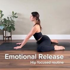 a woman is sitting on the floor in a yoga pose