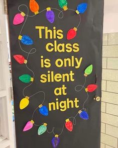 this class is only silent at night bulletin board with christmas lights on the front door