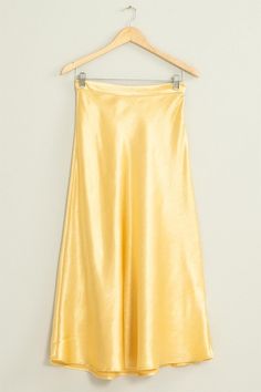 Satin gold shimmering midi skirt. NOTE: If your size is not available, please register your email in EMAIL ME WHEN AVAILABLE link. Chic Flowy Metallic Skirt, Chic Metallic Flowy Skirt, Glamorous Long Gold Skirt, Glamorous Gold Long Skirt, Elegant Gold Maxi Skirt For Spring, Gold Long Skirt For Summer, Gold Long Skirt For Evening, Yellow Long Skirt For Evening, Chic Gold Maxi Skirt