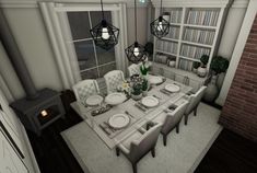 a dining room table and chairs in front of a brick wall with bookshelves