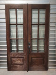 two wooden doors with glass on each side