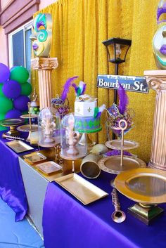 a table topped with lots of different types of cakes