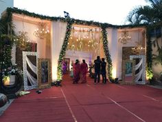 people standing in front of a decorated stage