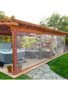 an outdoor hot tub and jacuzzi in the back yard with grass around it