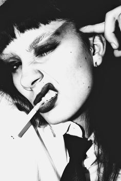 punk girl with a cigarette on a black and white photo Punk Rock Portrait Photography, 70s Punk Photography, Rock Star Portraits, Punk Film Photography, Punk Rock Editorial, 90s Grunge Editorial, Black And White Punk Photos, Rockstar Portrait Photography, Punk Rock Portrait