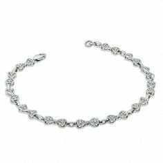 Treat the one you adore to this meaningful look of love. Well-crafted in sleek sterling silver, this bracelet features clever point-to-point heart-shaped links, each centered with a single diamond accent. Buffed to a brilliant shine, this 7.25-inch bracelet secures with a lobster claw clasp. Elegant Heart-shaped Tennis Bracelet With Diamond Accents, Classic Heart-shaped Diamond Bracelet For Formal Occasions, Elegant Silver Diamond Heart Bracelet, Classic White Gold Heart Bracelet, Elegant Heart-shaped Brilliant Cut Diamond Bracelet, Formal White Gold Heart Tennis Bracelet, Elegant Heart-shaped Sterling Silver Bracelet For Formal Occasions, Elegant Silver Heart-shaped Tennis Bracelet, Elegant Heart-shaped White Gold Diamond Bracelet