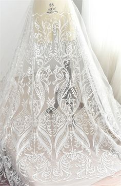 This Stunning Luxury High quality Embroidered Lace Fabric design piece has soft hand feel, ideal for use in DIY craft projects, wedding dress, clothing, party dress, dolls outfits, curtains, shams, lamp shades, headpieces, costumes, accessories, Apparel, handcraft Accessory, cake decor, unity candle, garters, headbands, dance costumes, belly dance costumes. --- THE DETAILS --- This listing is for 1 yard embroidery lace fabric. Wide: about 51inch/130cm Colors: Off white As shown in the picture Ma Tulle Embroidery, White Lace Fabric, Bridal Lace Fabric, Embroidered Lace Fabric, Fabric Diy, Wedding Dress Fabrics, Lace Veils, Lace Mermaid, Custom Wedding Dress