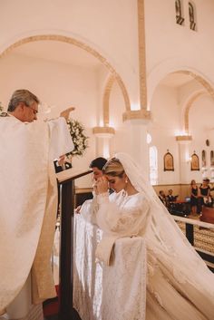 the bride and groom are getting ready to walk down the aisle