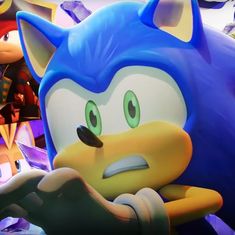 sonic the hedgehog is surrounded by other characters