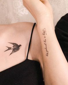 a woman's arm with a bird tattoo on the left side of her arm