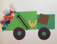 a paper cut out of a green truck with flowers on the front and back side