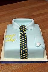 a blue cake with a yellow and black tie on it