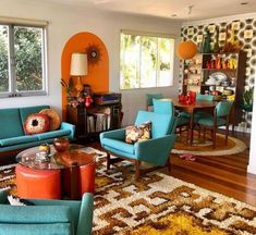 a living room filled with blue couches and chairs