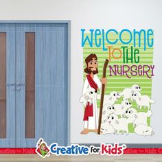 a child's room with a cartoon jesus holding a sticker that says welcome to the nursery