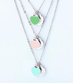 One cannot go wrong with classics such as a delicate heart pendant.This necklace is the epitome of timeless romantic elegance.two small stainless steel heart and enamel are suspended on a 15 1/2 in long with 2 in extender chain (total 17.5 in long) stainless steel chain.Both hearts are 1cm longThe pendant is enameled and comes in 3  beautiful colors - pale pink, , sky blue and mint green. Initial Heart Necklace, Custom Pet Tags, Girl Necklace, Retirement Gifts For Women, Dog Collar Tags, Rose Gold Bangle, Metal Bookmarks, Crystal Bangle, Necklace Heart