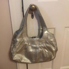 In Great Condition! Small Stains On The Interior Which Are Shown Tons Of Pockets! Comes With A Cross Body Strap Gold Formal Hobo Shoulder Bag, Formal Gold Hobo Shoulder Bag, Gold Formal Shoulder Hobo Bag, Elegant Silver Hobo Shoulder Bag, Elegant Silver Hobo Bag, Gold Satchel Hobo Bag For Formal Occasions, Silver Bag With Gold-tone Hardware For Daily Use, Gold Leather Bag With Silver-tone Hardware, Gold Hobo Shoulder Bag With Handle Drop