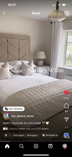 the bed is made with white sheets and pillows on it's headboard, which reads pull - n - neng white