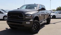 a gray ram truck parked in a parking lot