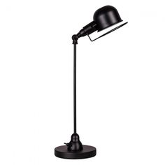 a black lamp on a white background with clippings to the side and one arm